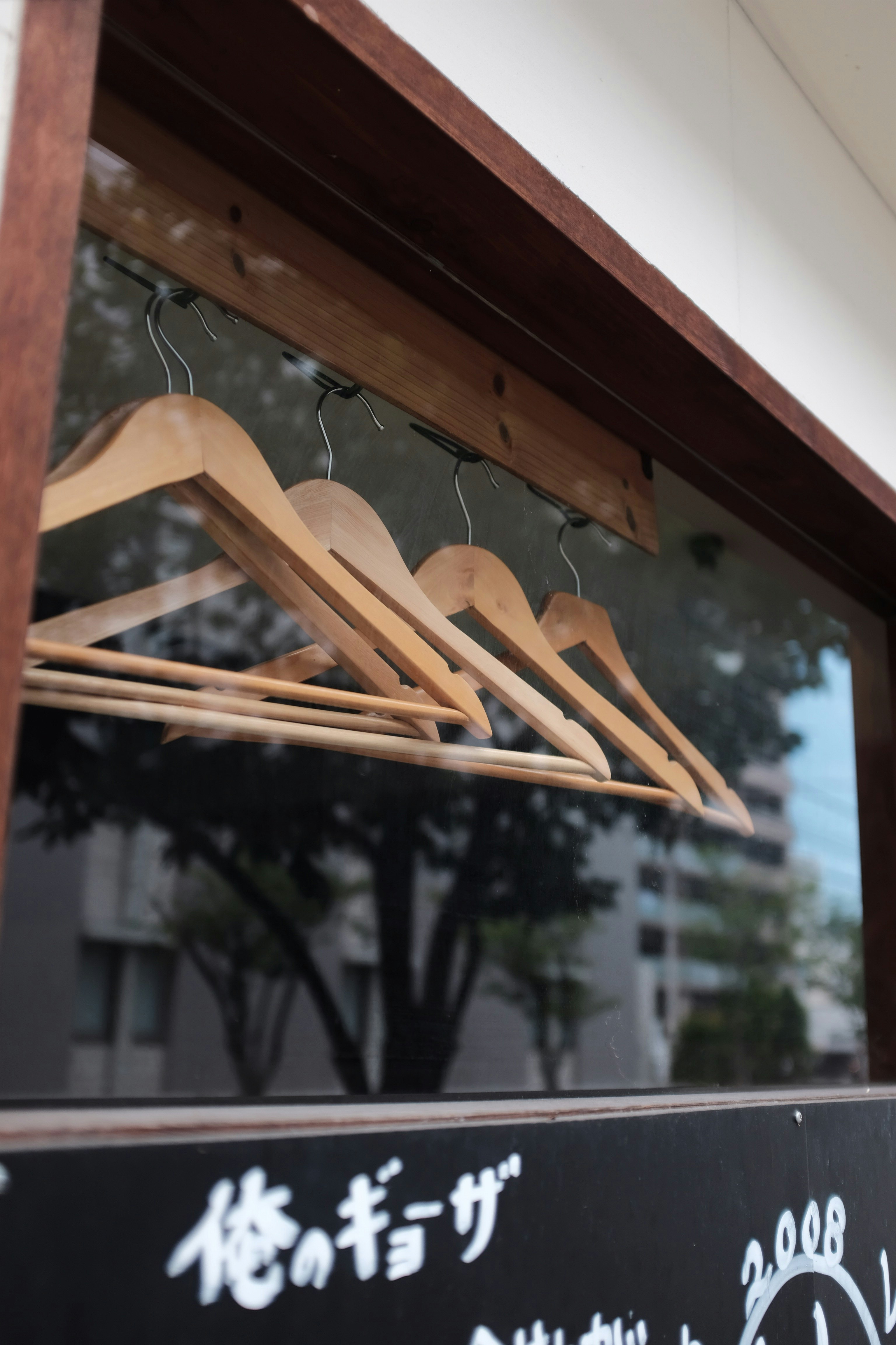 brown wooden hangers close-up photography